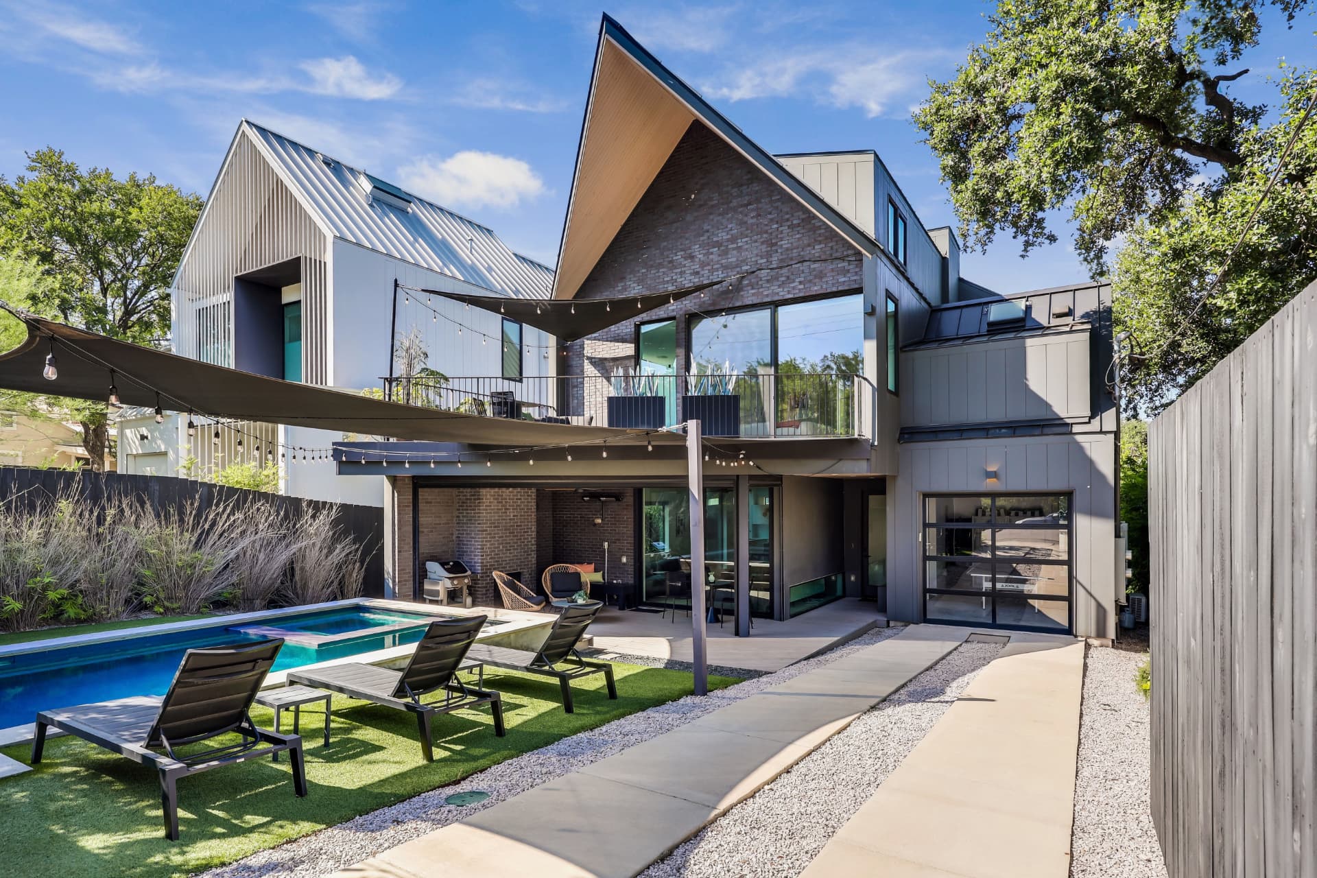 Backyard pool and modern exterior of a represented property